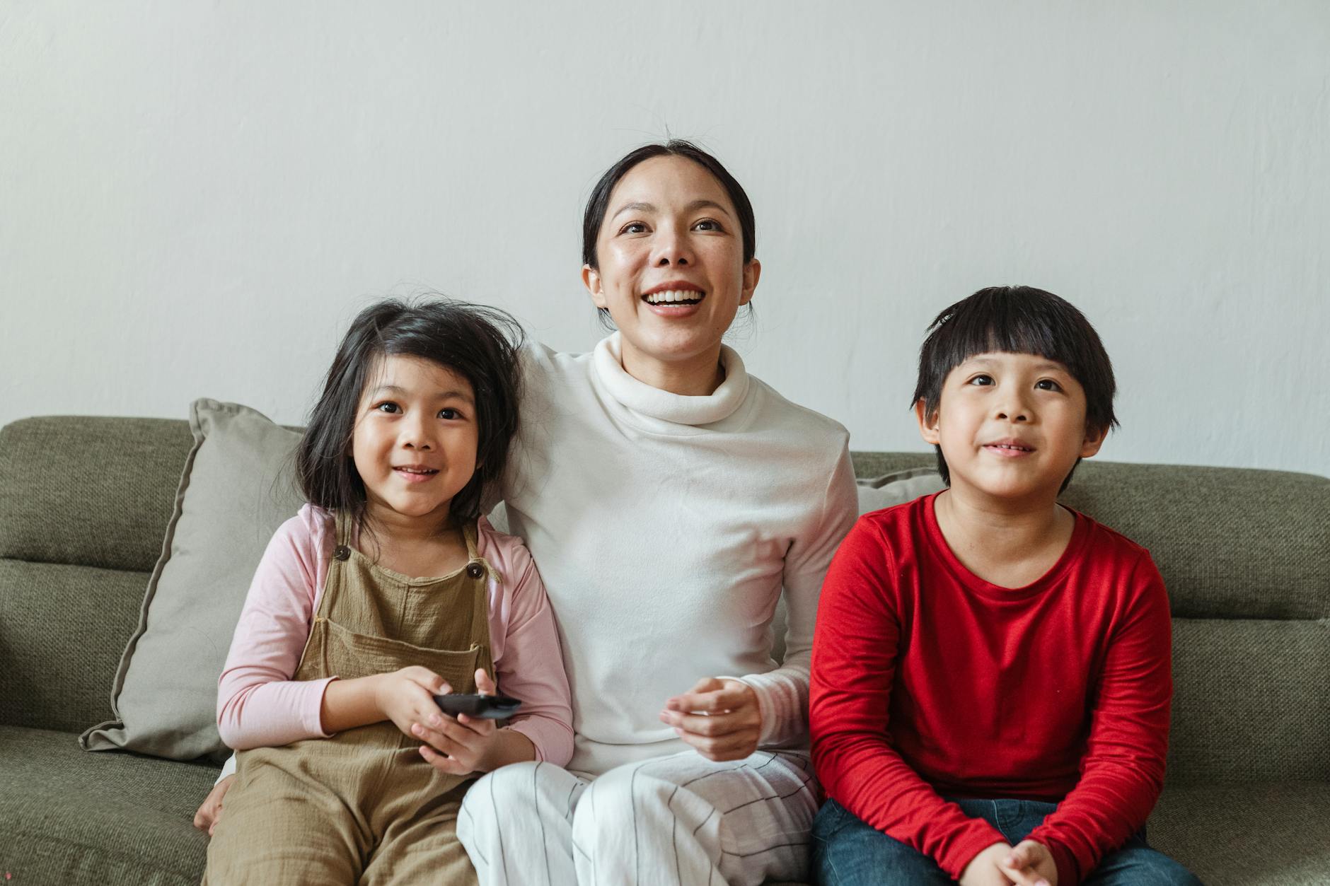Family watching TV with broadband package at home